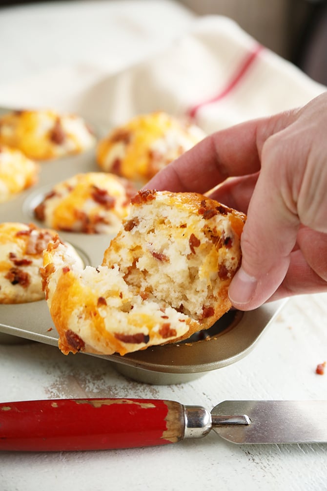 Bacon Cheddar Biscuits being held after slicing