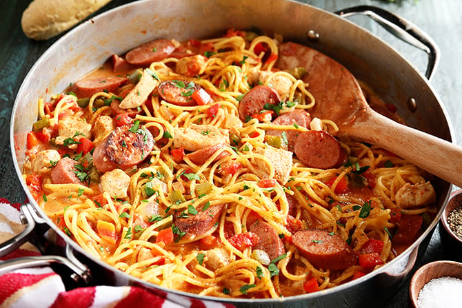 Creamy One Pot Jambalaya Pasta being served with spoon