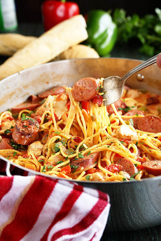 Creamy One Pot Jambalaya in pot being served with fork