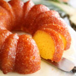 Pineapple Juice Cake while serving a slice close photo