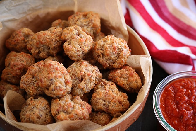 Pizza Sausage Balls with dipping sauce on side