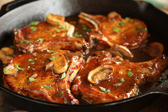 Skillet Chops with French Onion Gravy with sliced mushrooms on top