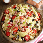 Kitchen Sink Pasta Salad with package of sausage in the backgroud