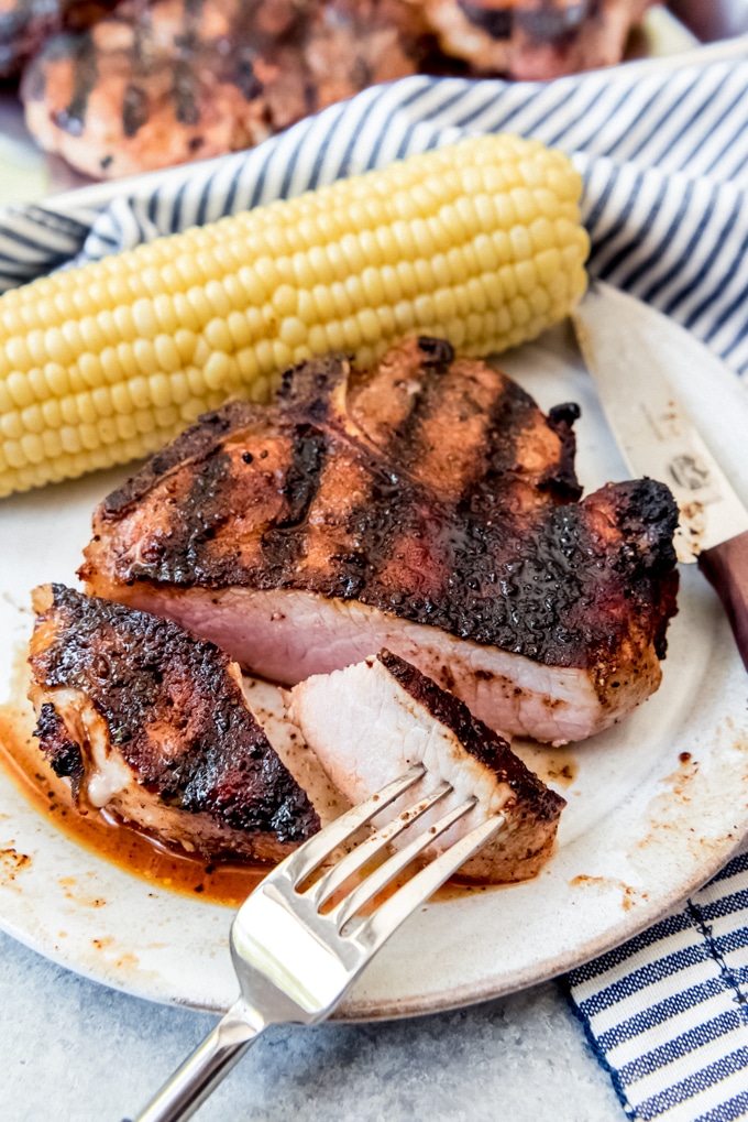 Perfect grilled pork chops with bite cut out