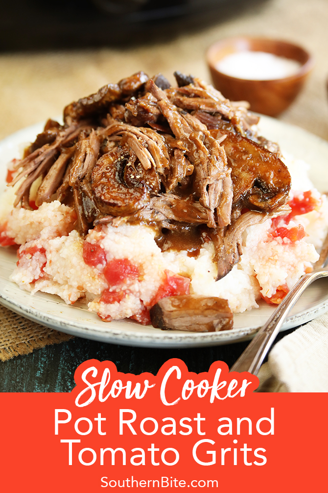 Slow cooker pot roast served over tomato grits close photo