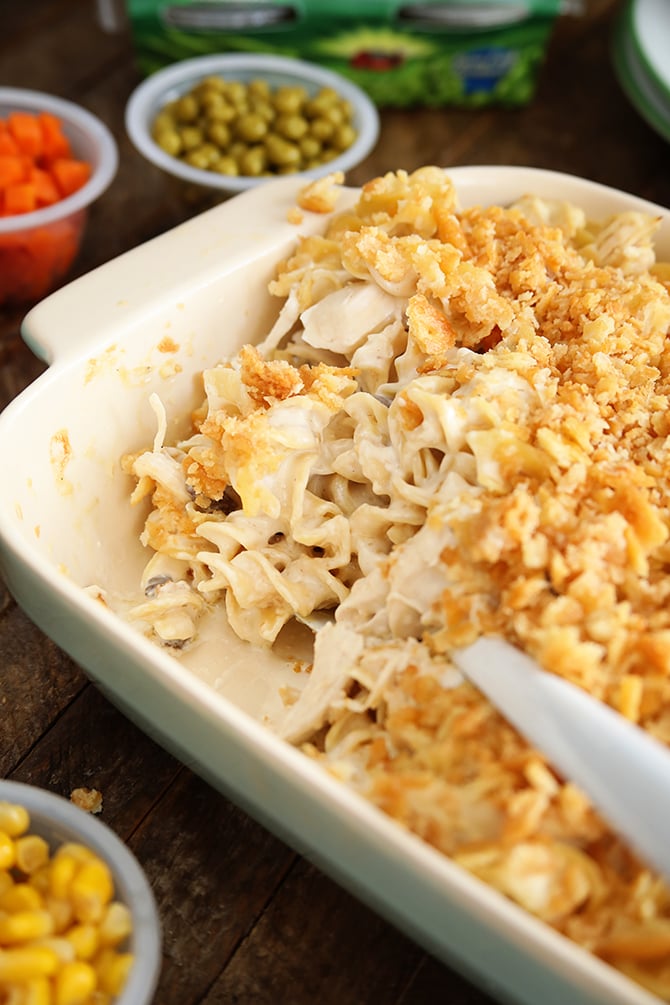 Family Favorite Chicken Noodle Casserole being seved with spoon