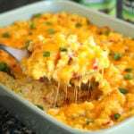 Ultimate Cheesy Corn and Rice being served closer shot