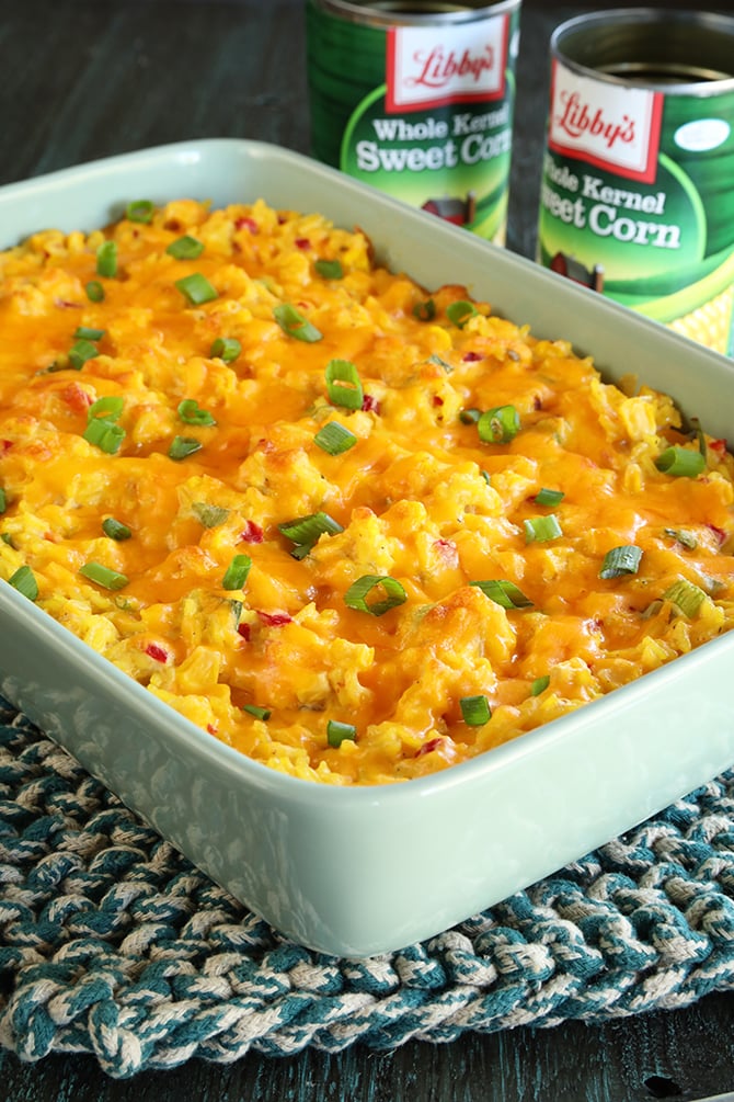 Ultimate Cheesy Corn and Rice Casserole in green serving dish