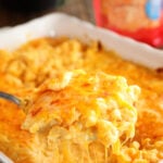 Cheesiest Mac and Cheese in casserole dish with package of cheese