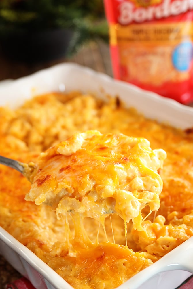 Cheesiest Mac and Cheese in casserole dish with package of cheese