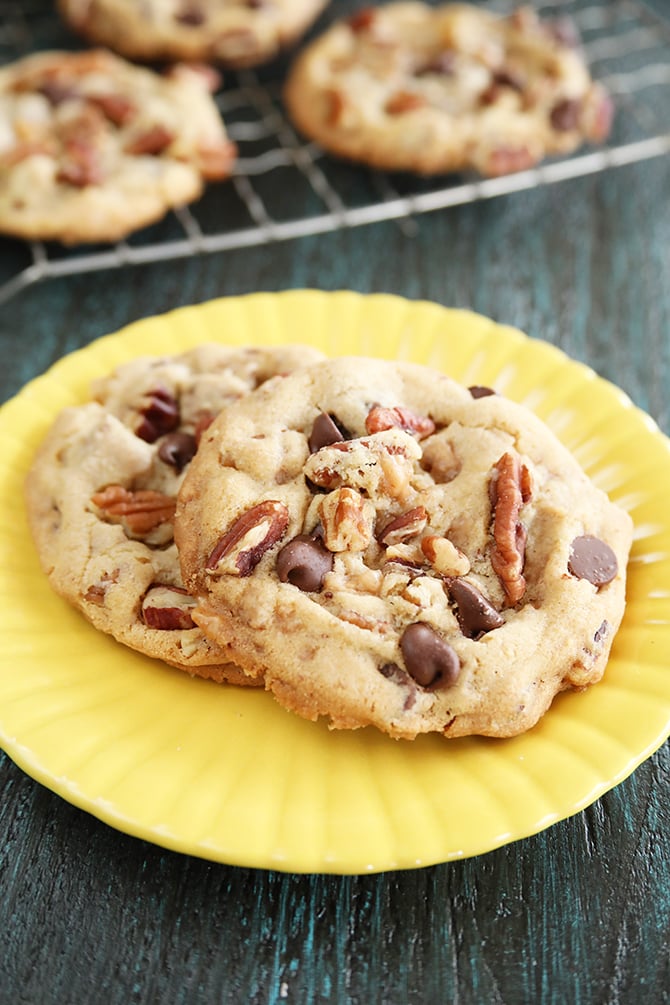 Chocolate Chip Toffee Pecan Cookies on yellow plate