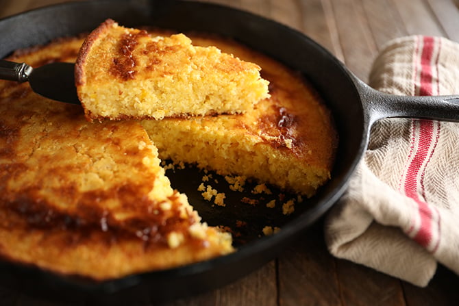 Sliced Creamed Cornbread served in iron skilit