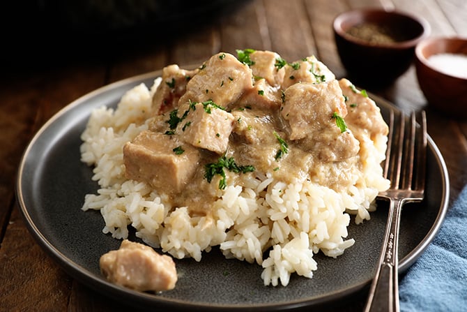 Pork tips over rice