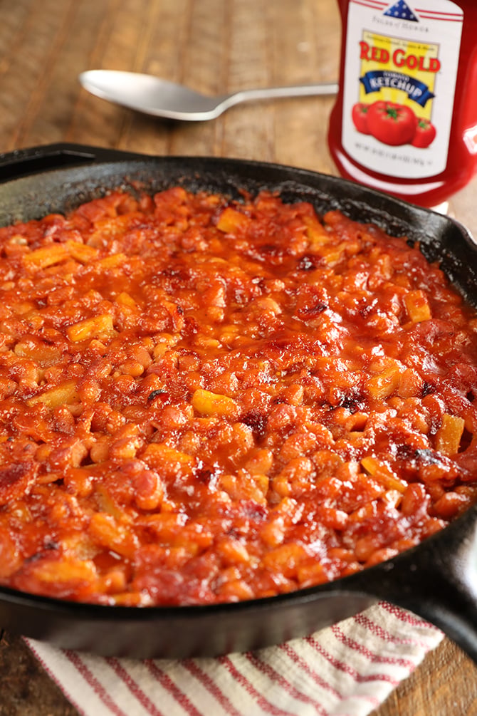 Bacon Pineapple Baked Beans in a cast iron skillet
