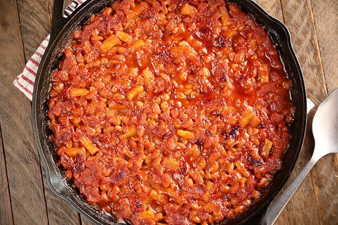 Bacon Pineapple Baked Beans in a cast iron skillet