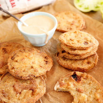 Fried green tomatoes on borwn paper with remoulade sauce