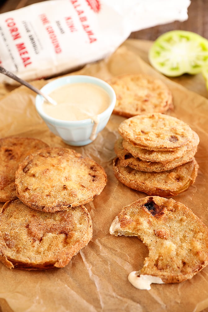 Fried green tomatoes on borwn paper with remoulade sauce