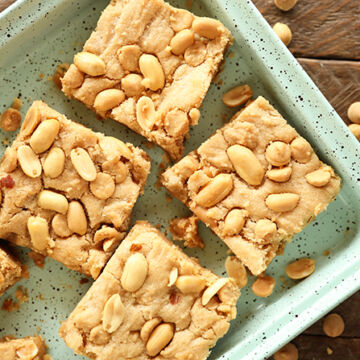Chewy peanut Butter Cookie Bars on green tray