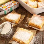 Slices of Gooey butter Cake dusted with powdered sugar