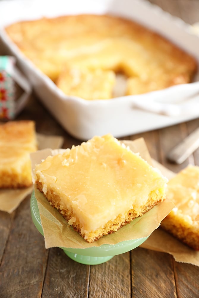 Slice of Gooey Butter Cake on pedestal