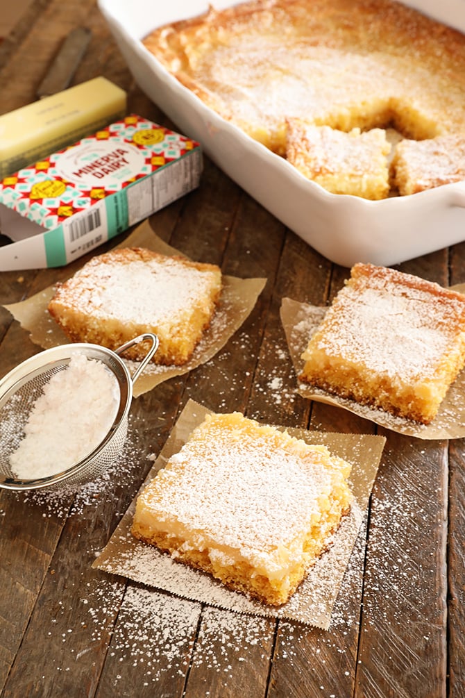 Slices of Gooey butter Cake dusted with powdered sugar