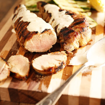 Grilled Pork tenderloin with white bbq sauce over it
