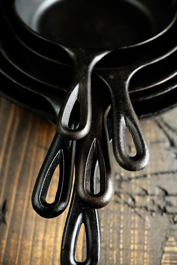 Stack of cast iron skillet handles