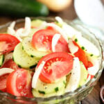 Tomto, Cucumer, and Onion Salad in a clear bowl