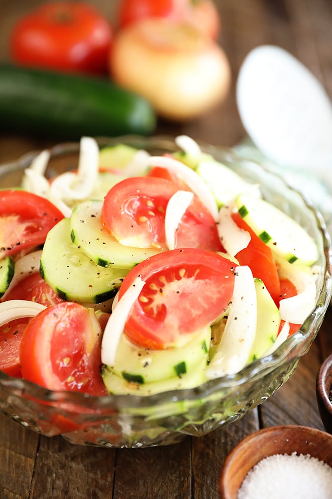 Tomto, Cucumer, and Onion Salad in a clear bowl