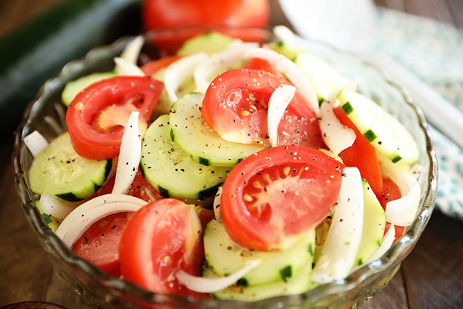 Tomto, Cucumer, and Onion Salad in a clear bowl