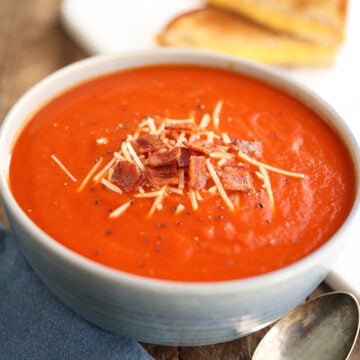 Tomato Soup topped with Bacon and cheese