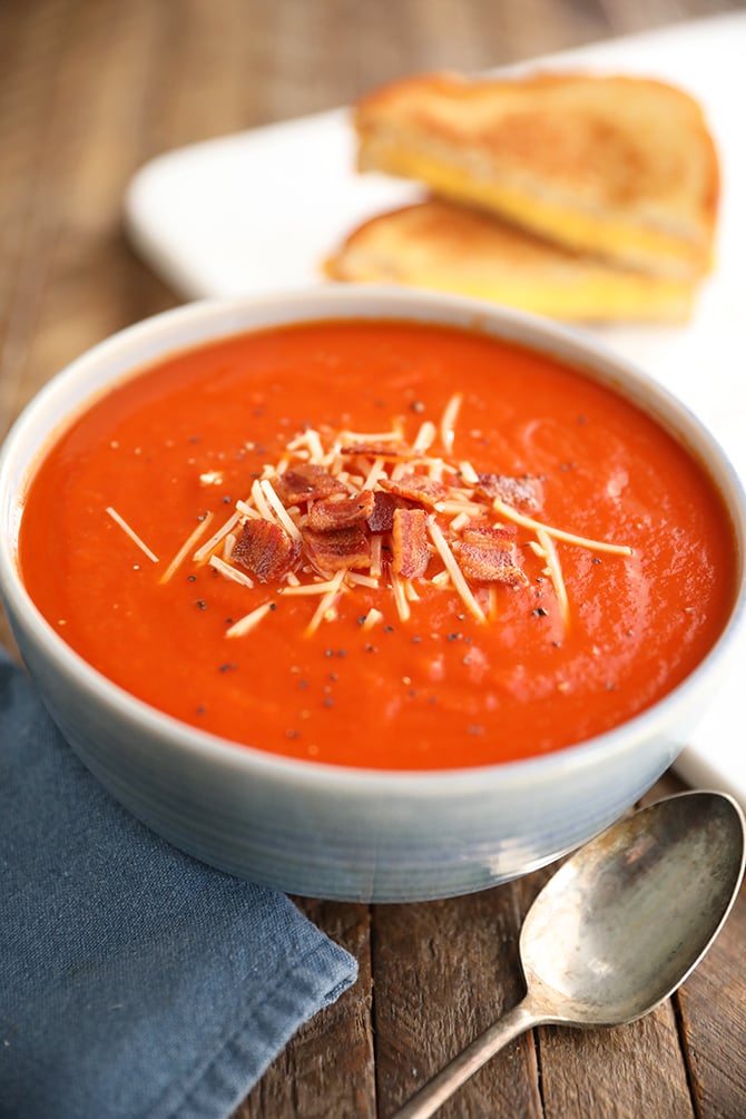 Tomato Soup topped with Bacon and cheese