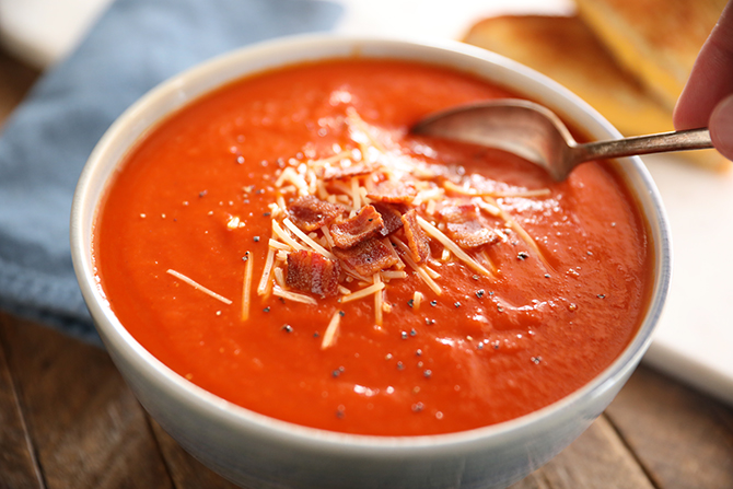 Tomato Soup topped with Bacon and cheese