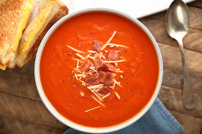 Tomato Soup topped with Bacon and cheese