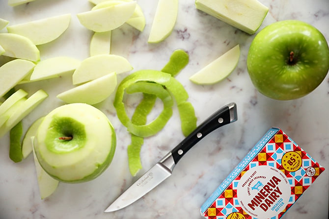 Peeled apples with knife