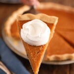 Slice of Sweet Potato Pie with whipped cream.
