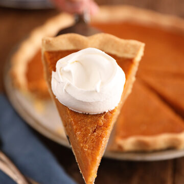 Slice of Sweet Potato Pie with whipped cream.