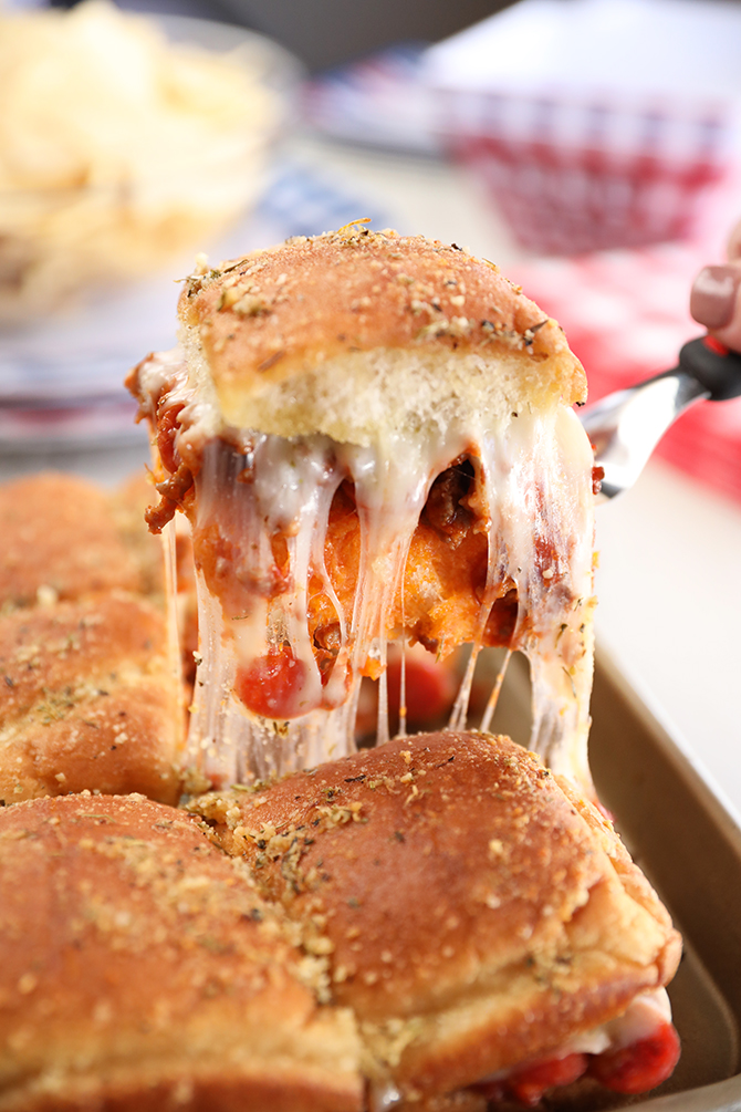 Cheese pull remvoing some Easy Pizza Sloppy Joe Sliders