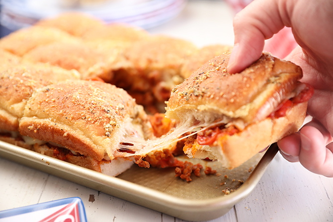 Hand grabbing an Easy Pizza Sloppy Joe Slider