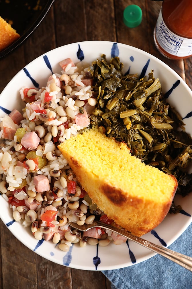 Bolw of Hoppin John, collards, and cornbread
