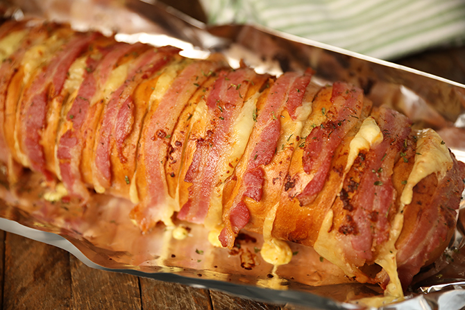 Cheesy Swiss Bacon Ranch Bread on aluminum foil