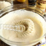 Easy Creamy Caesar Dressing being mixed in a bowl
