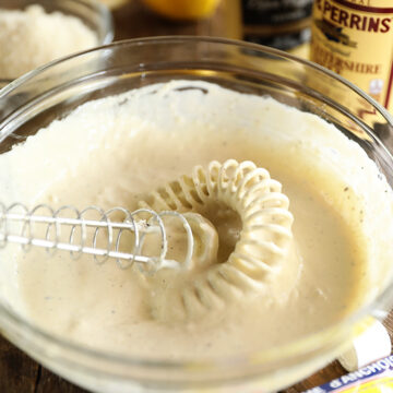 Easy Creamy Caesar Dressing being mixed in a bowl