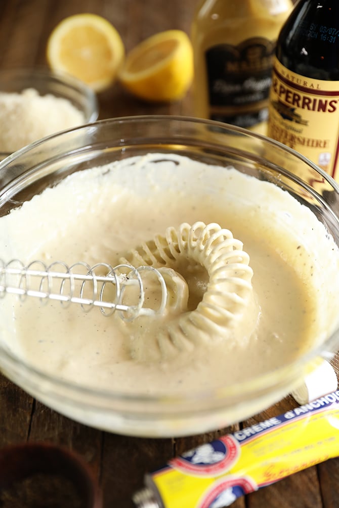 Easy Creamy Caesar Dressing being mixed in a bowl