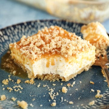 Bite missing from slice of Caramel Pecan Shortbread No-Bake Cheesecake