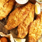 Pieces of Lemon Pepper Fried Catfish with lemons