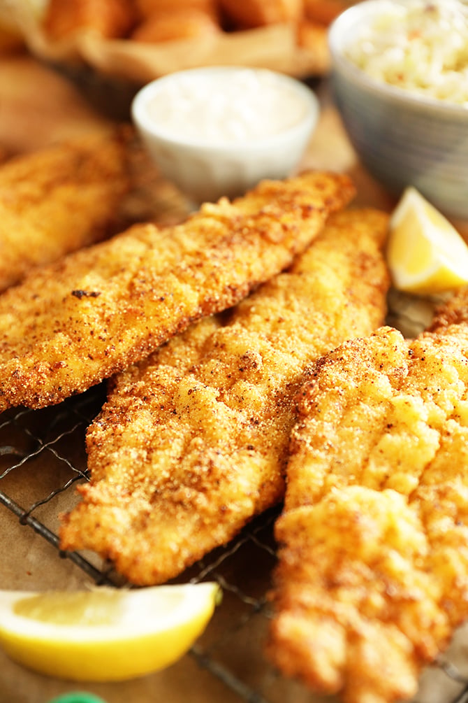 Pieces of Lemon Pepper Fried Catfish with lemons