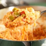Spoonful of Cheesy Shrimp and Orzo Skillet with cheese pull