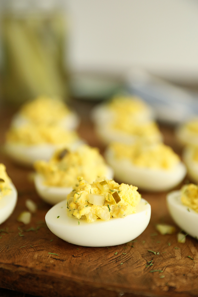 Dill Pickle Deviled Eggs on cutting board