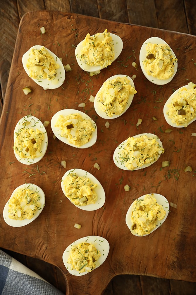 Dill Pickle Deviled Eggs on cutting board